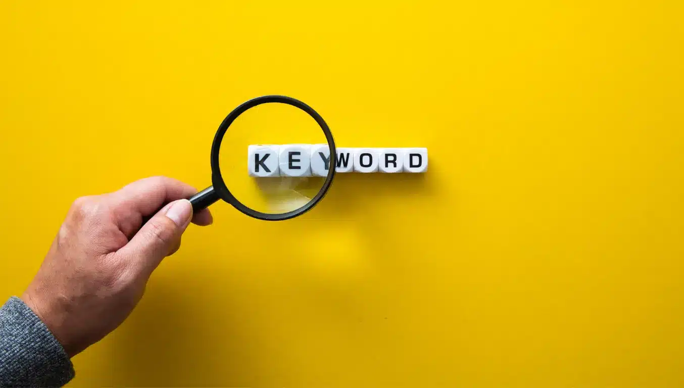keyword through magnifying glass resembling keyword research