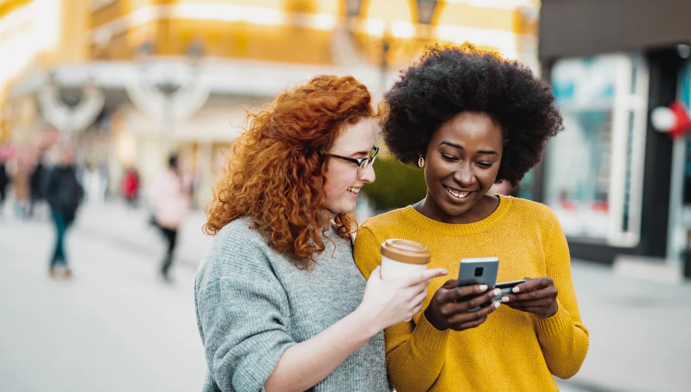 two people looking at their phone